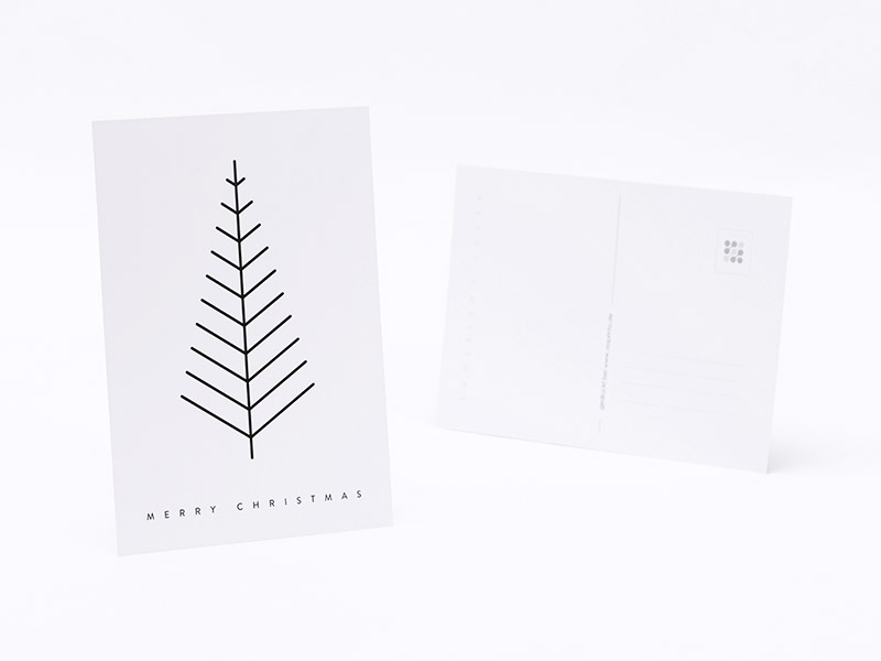 Ein Fächer von weißen Postkarten mit schwarzem schlichten Druck.